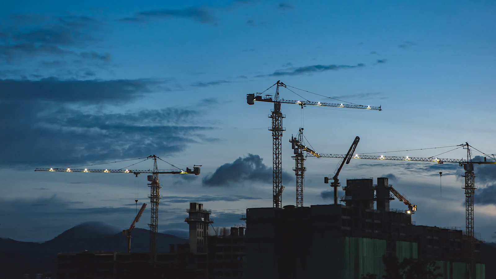 Construction cranes over the city