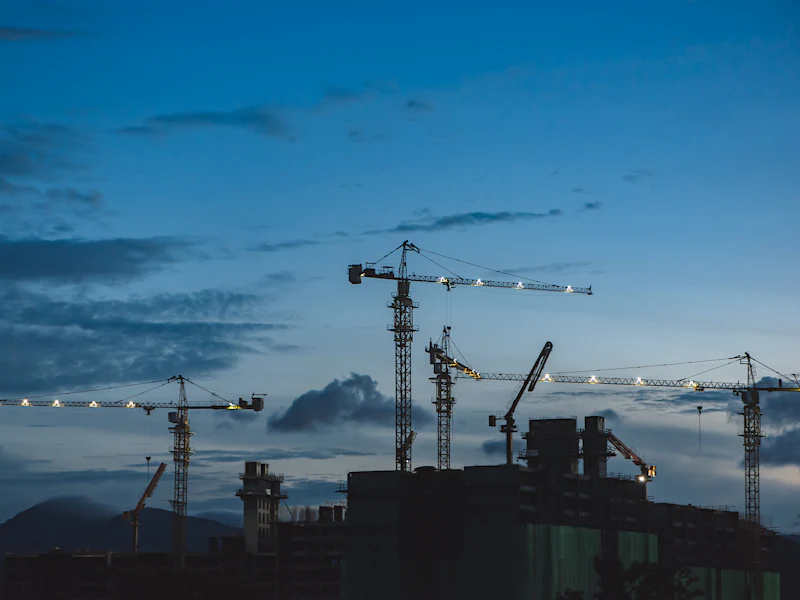 Construction cranes over the city