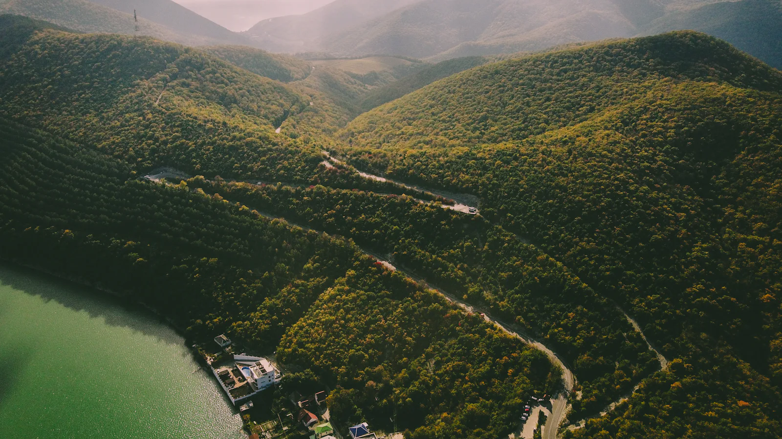 Road through a wooded valley